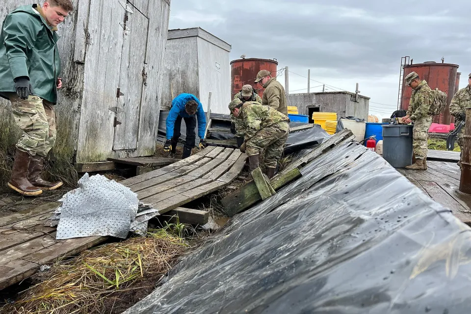 National Guard troops clearing storm debris in Newtok, Alaska
